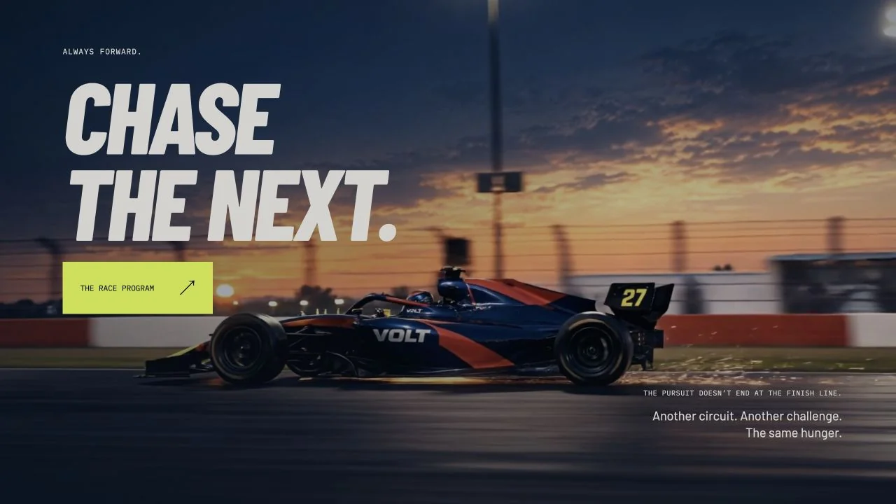 VOLT race-day story with the car passing the grandstands at dusk