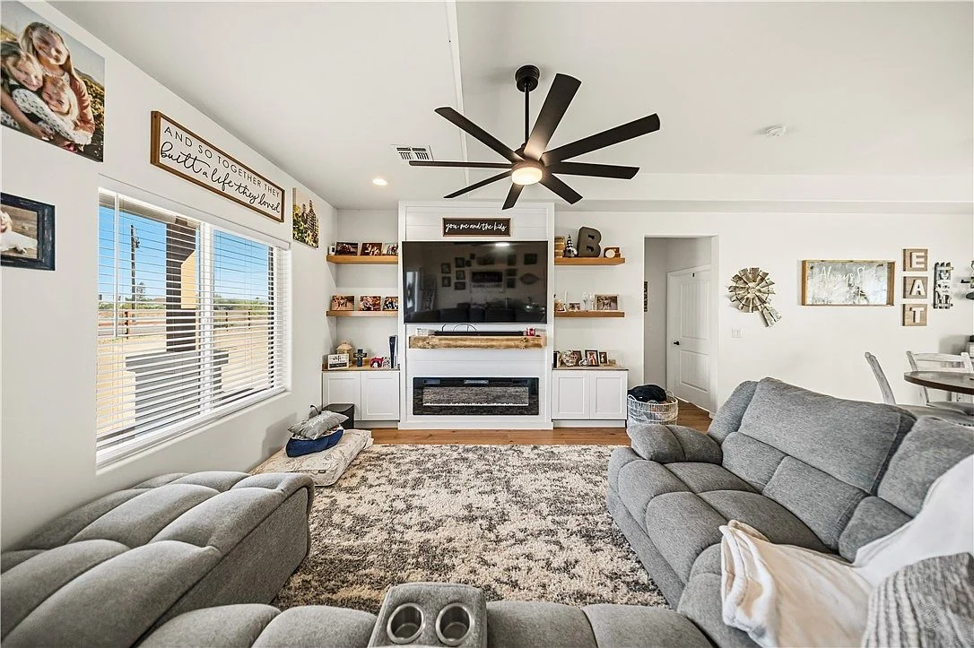 Original listing photograph of the furnished Salt Place living room